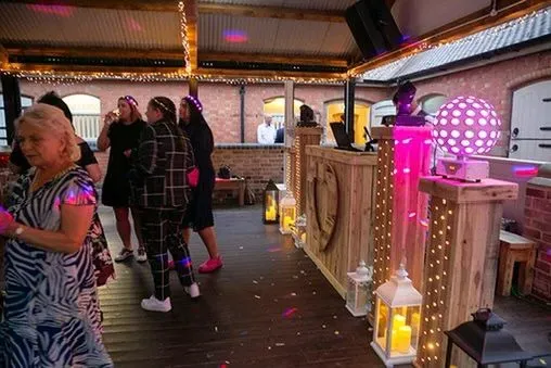 Vibrant wedding reception with happy guests dancing in Nottinghamshire