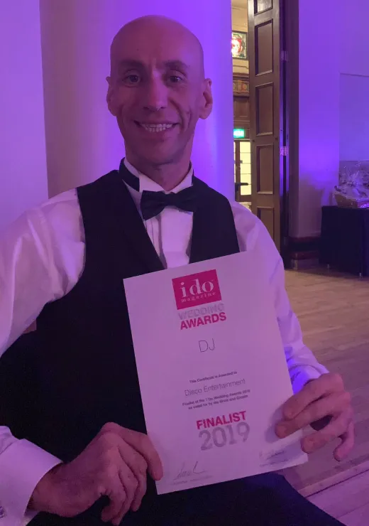 Disco Entertainers DJ holding an I Do Wedding Awards Finalist 2019 certificate, highlighting their award-winning status for wedding entertainment.